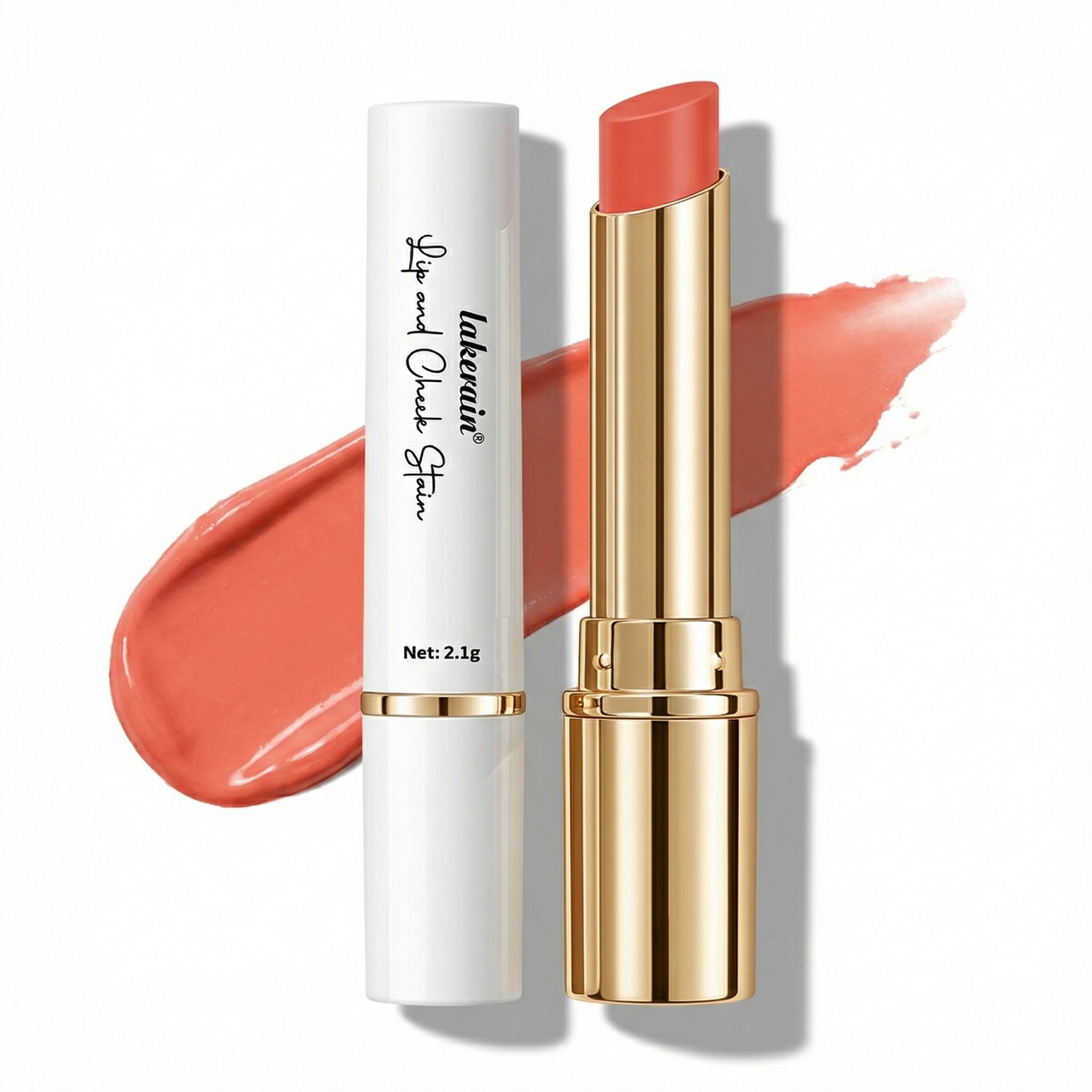 Lipstick with gold cap and white casing on a white background